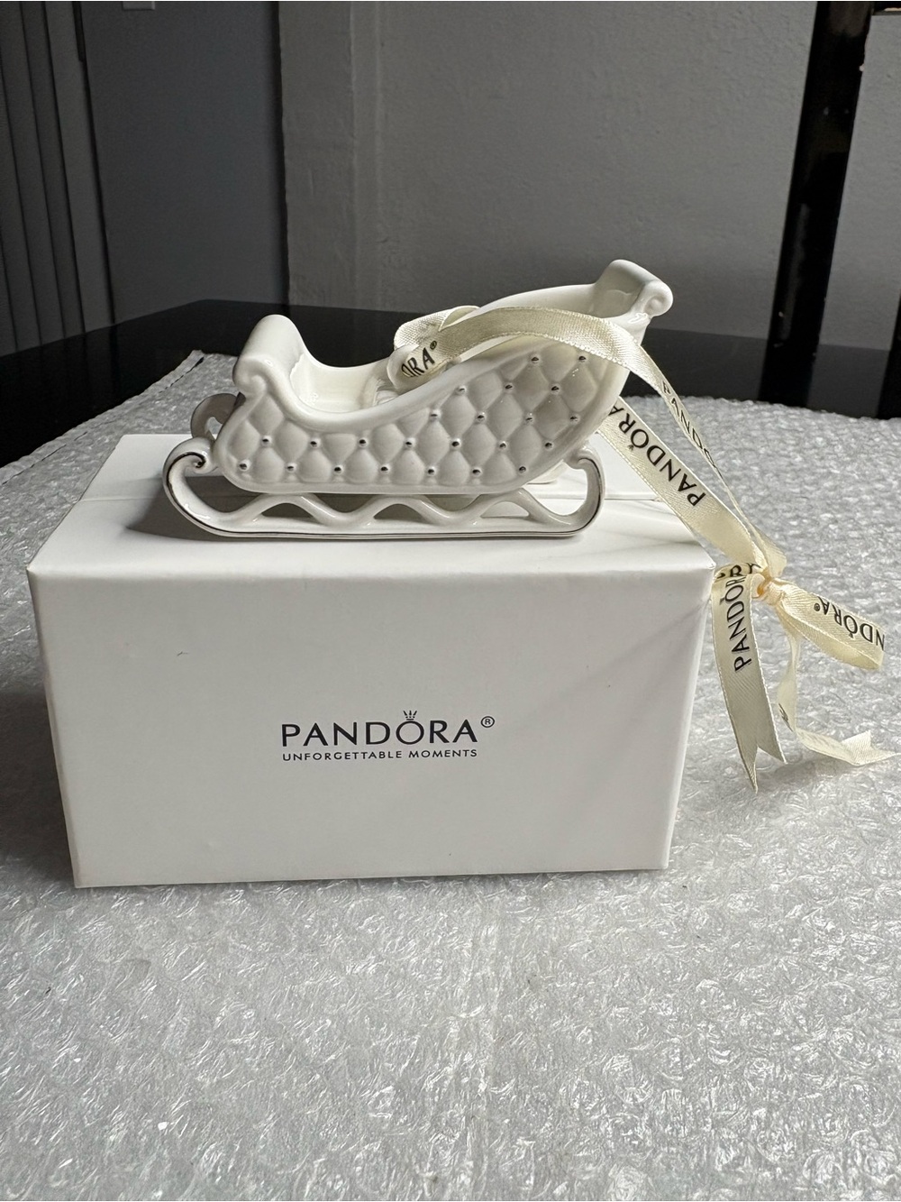 Pandora white porcelain sleigh ornament